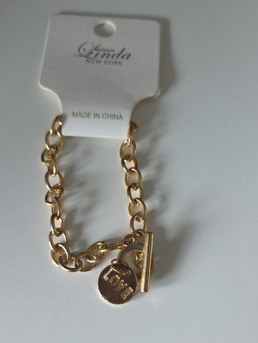 Gold Tone Toggle Link Bracelet with LOVE Charm